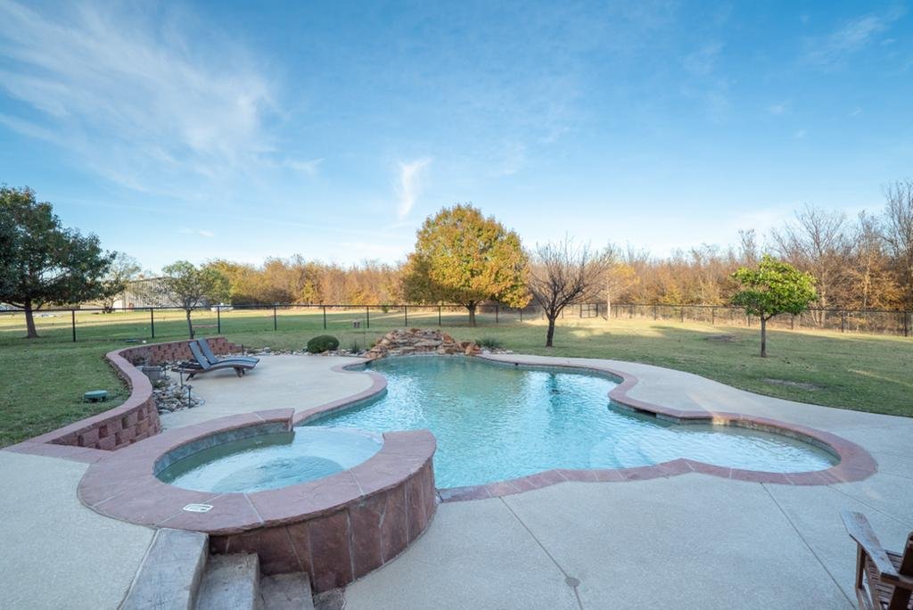 Resort-style swimming pool and raised spa at the estate