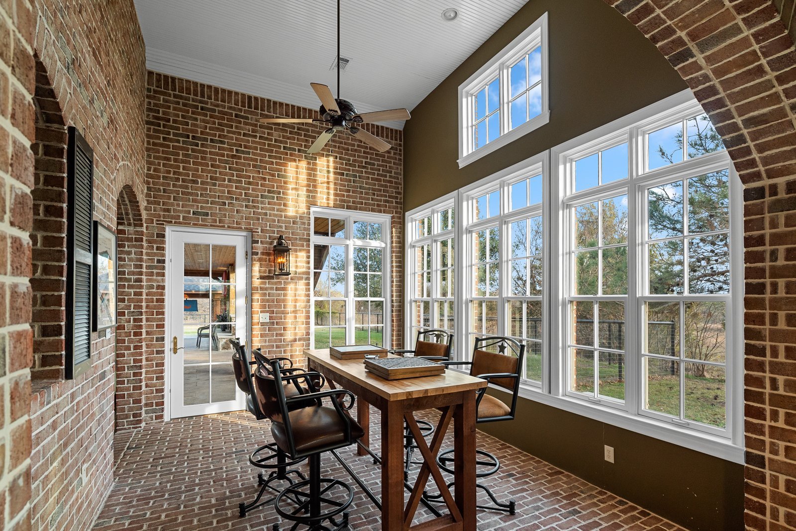 Bright sun room with brick arches